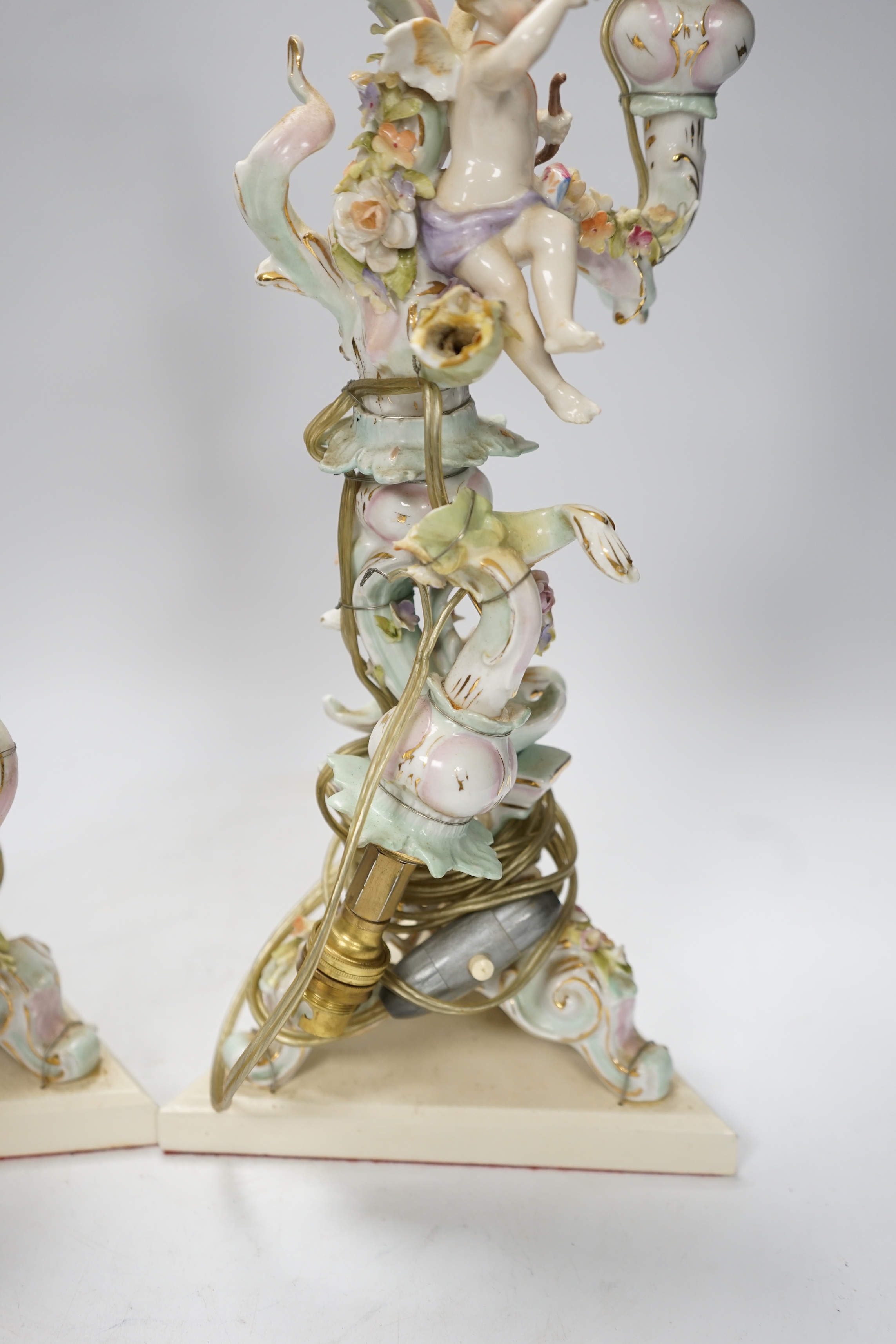 A pair of Sitzendorf floral encrusted porcelain table lamps, 42cm total